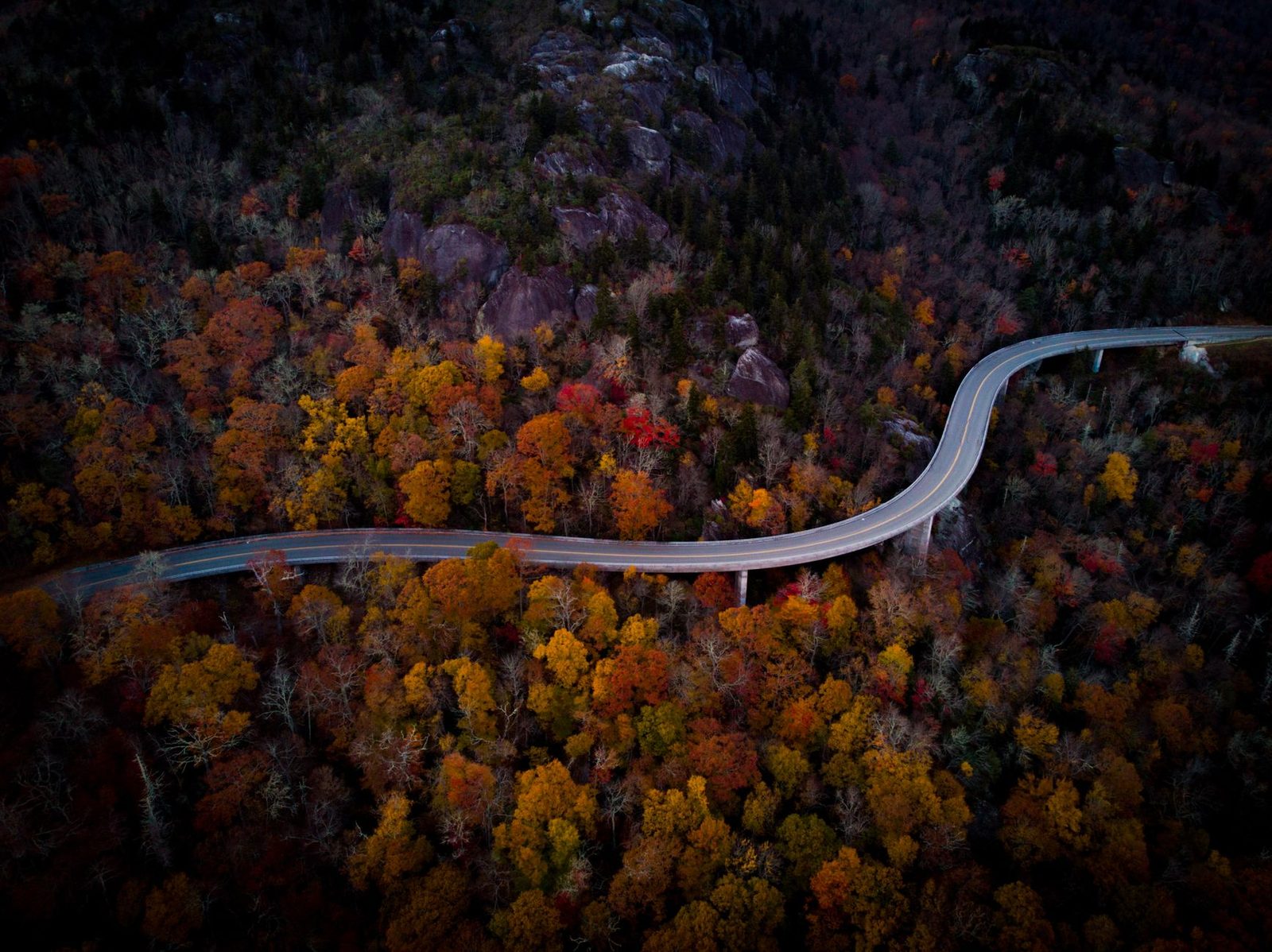 Winding mountain road through autumn foliage near Boone, North Carolina